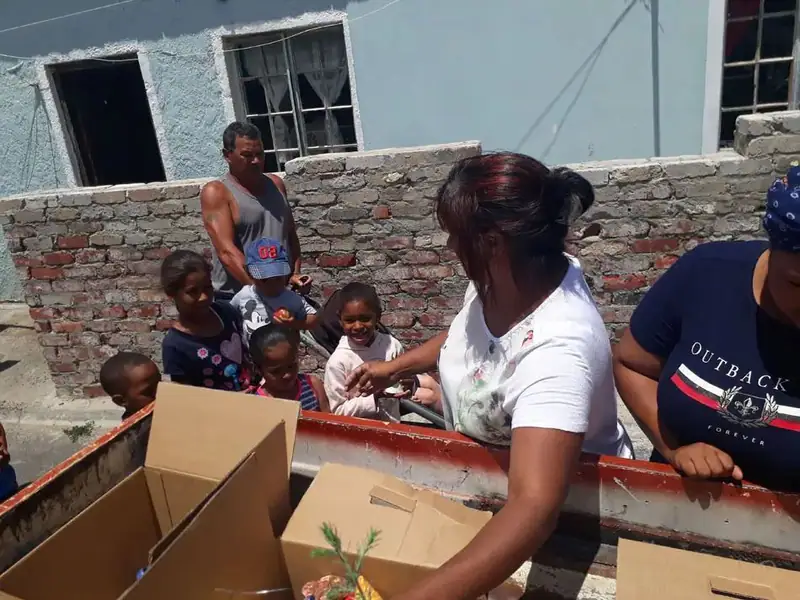 Volunteers and community members at a donation hand-out