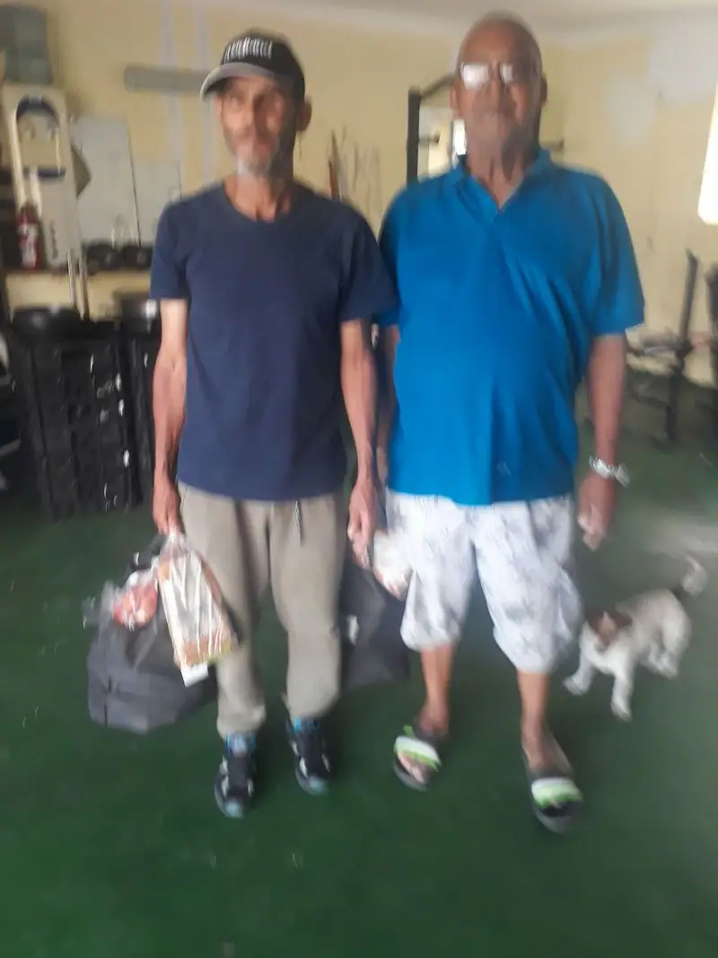 Two men with food parcels