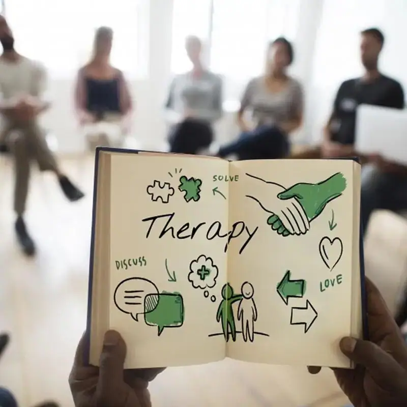 A hand-drawn therapy sign at a group session